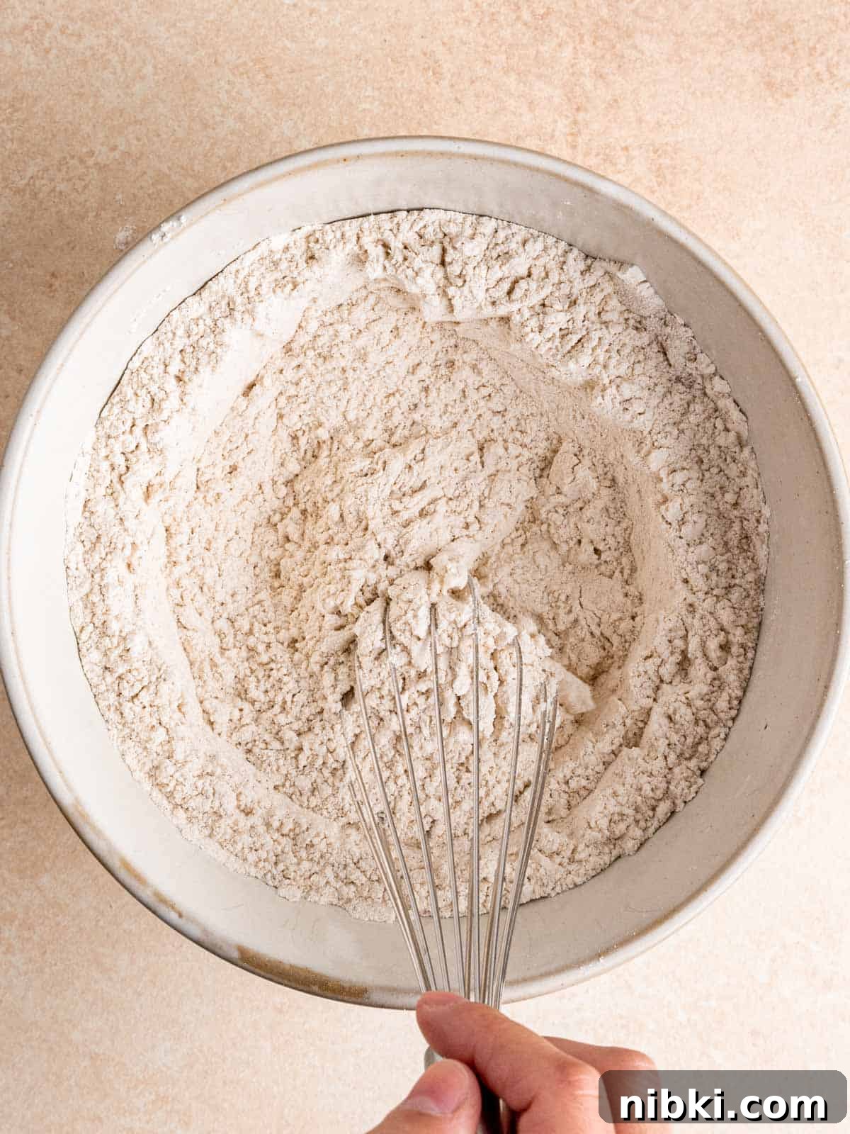 Browned Butter Snickerdoodles with Cinnamon Sugar 5 Whisking flour, baking soda, cream of tartar, salt, cinnamon and cardamom in a bowl.