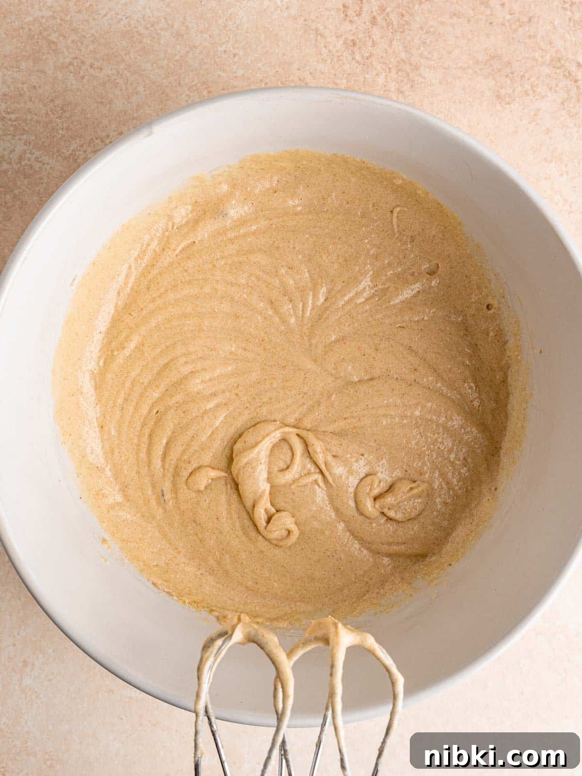 Browned Butter Snickerdoodles with Cinnamon Sugar 6 Wet cookie ingredients mixed together in a bowl.