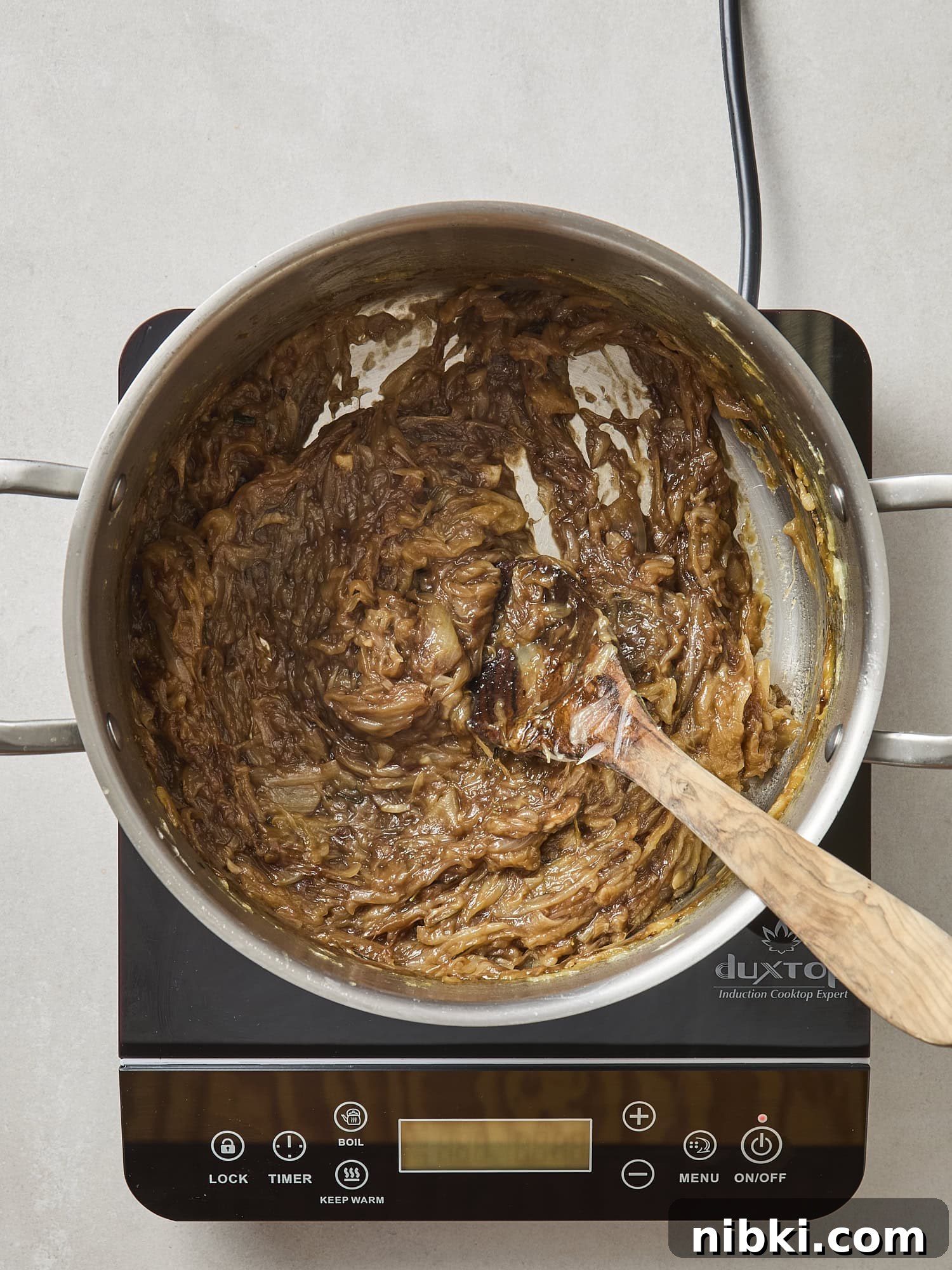 Caramelized Onion and Croissant Stuffing Recipe 7 Caramelized onions in a pot after cooking.
