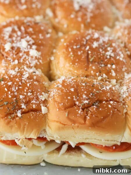 Pizza sliders made with hawaiian rolls.