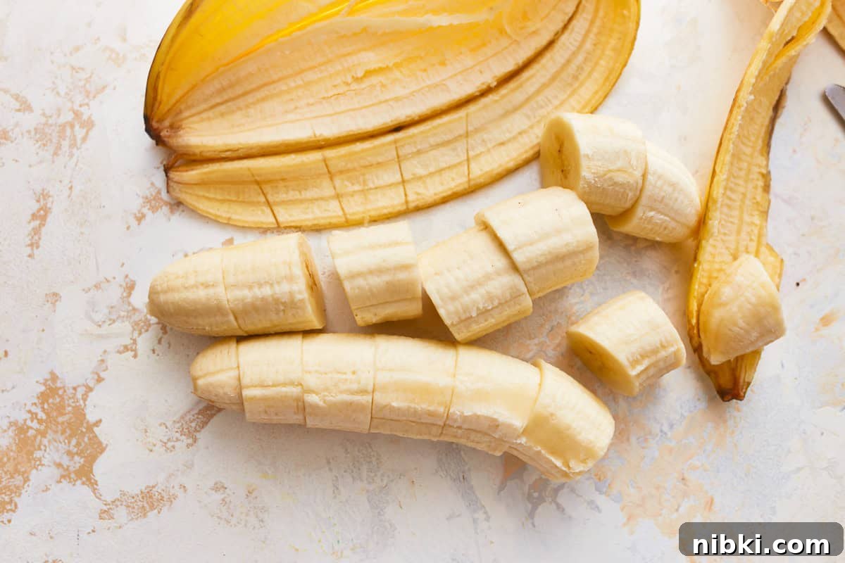 Crispy Fried Banana Fritters Recipe with Cinnamon Sugar 11 Two bananas chopped into pieces.