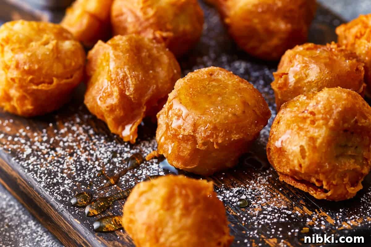 Crispy Fried Banana Fritters Recipe with Cinnamon Sugar 3 Breaded, deep-fried bananas.