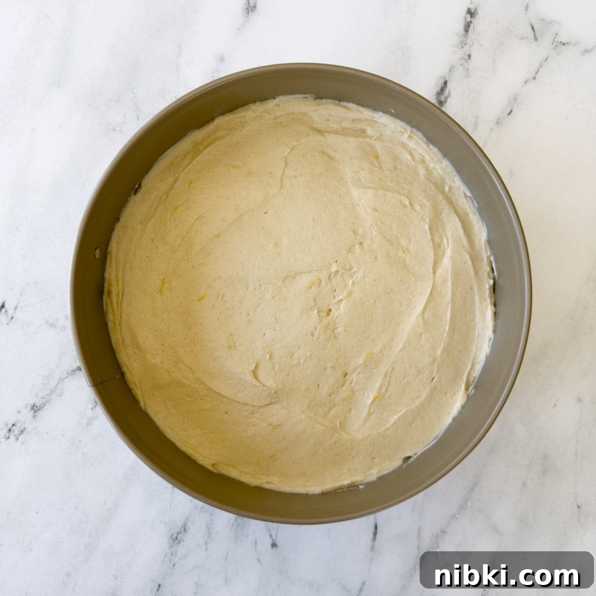 Gluten-Free Strawberry Shortcake Cake Recipe 10 Batter smoothed into a cake pan ready for baking.