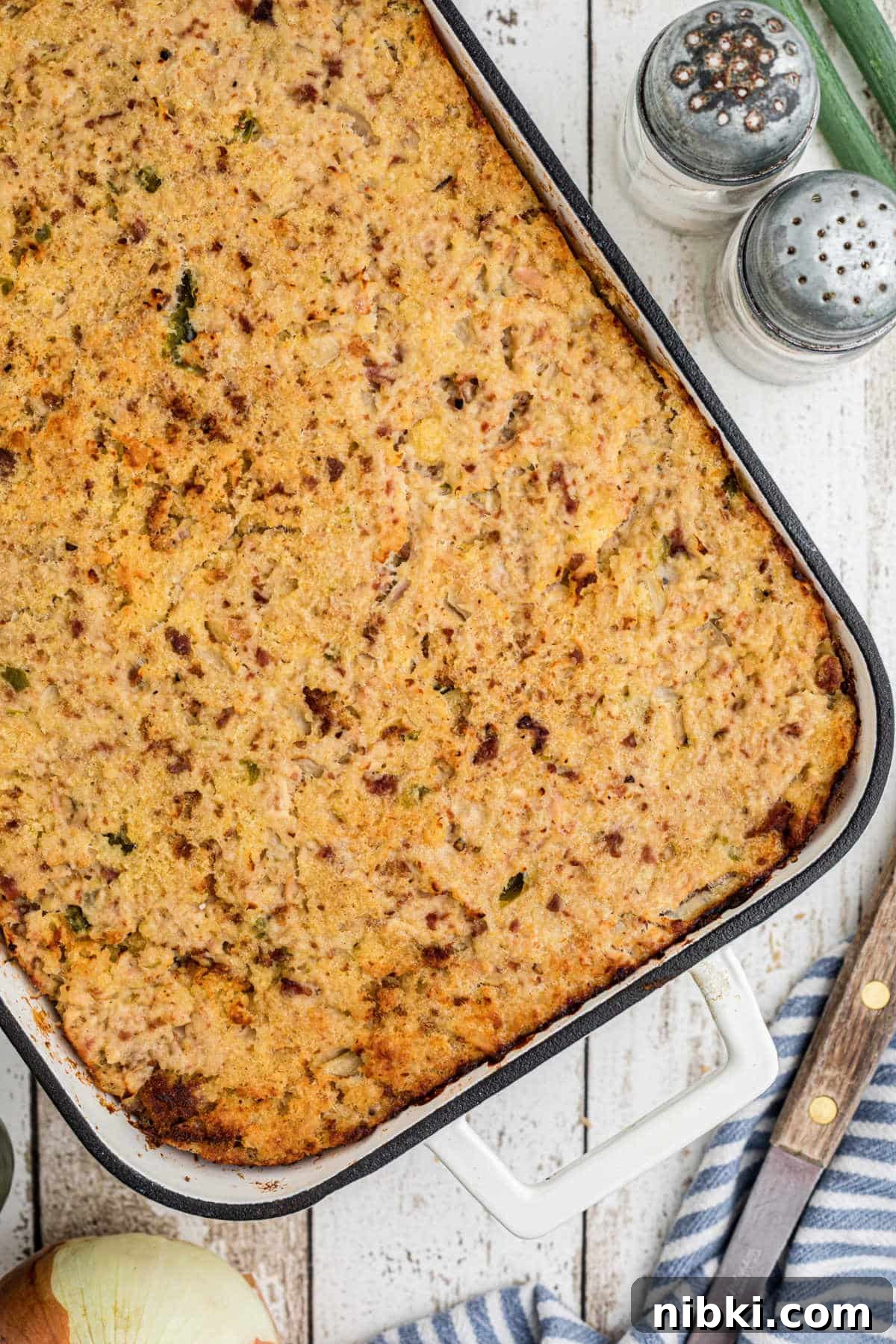 Authentic Cajun Cornbread Dressing Recipe 2 Overhead shot of a dish full of Cajun Cornbread Dressing.