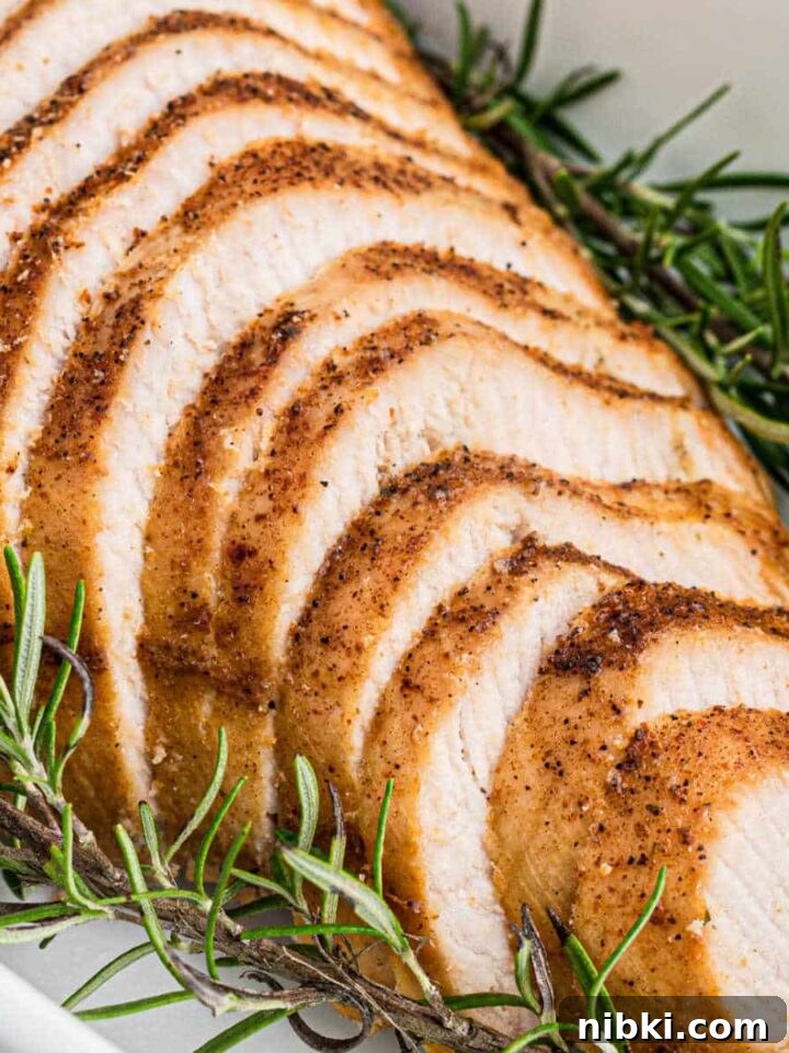 A sliced Cajun Turkey breast laid out sloping toward the camera.