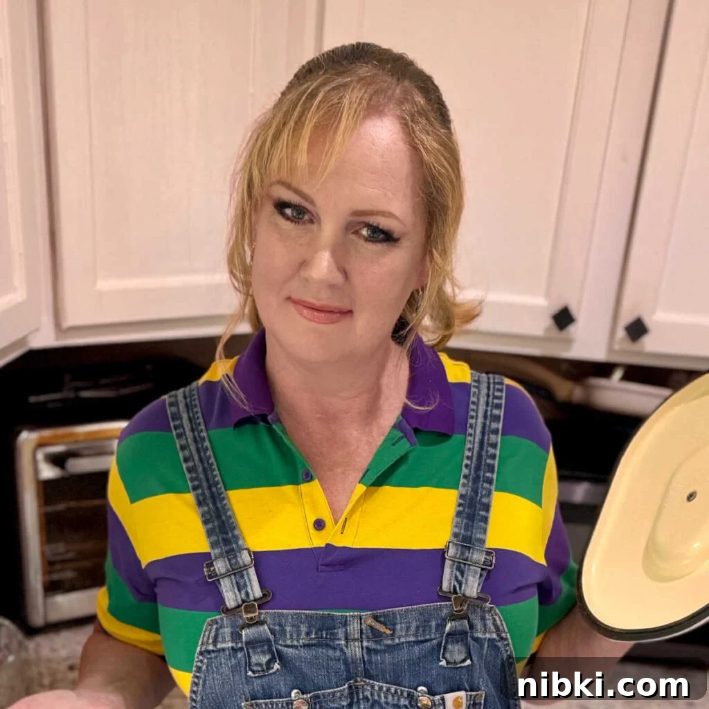 Authentic Cajun Cornbread Dressing Recipe 9 A picture of Melanie Cagle showing something in a cooking pot.
