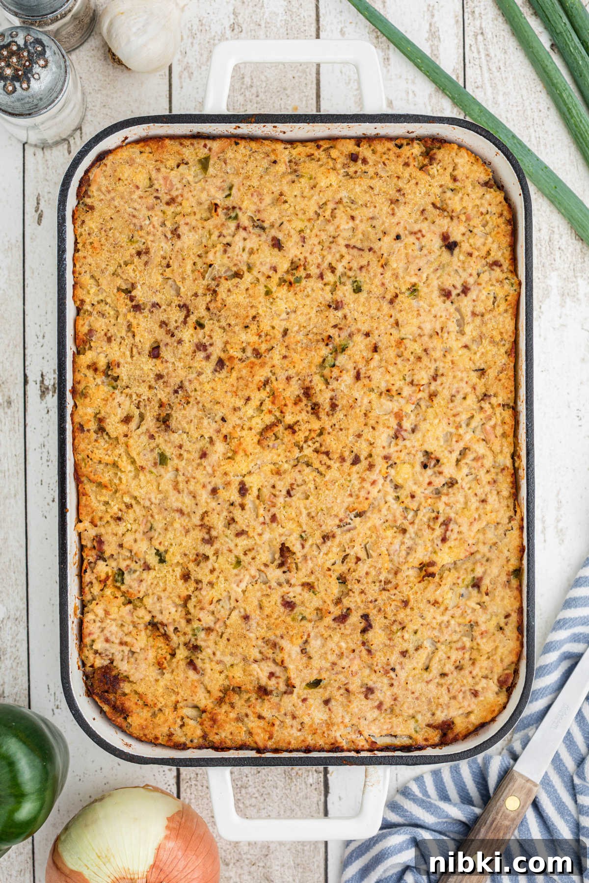 Authentic Cajun Cornbread Dressing Recipe 10 Overhead shot of a pan full of Cajun Cornbread Dressing.