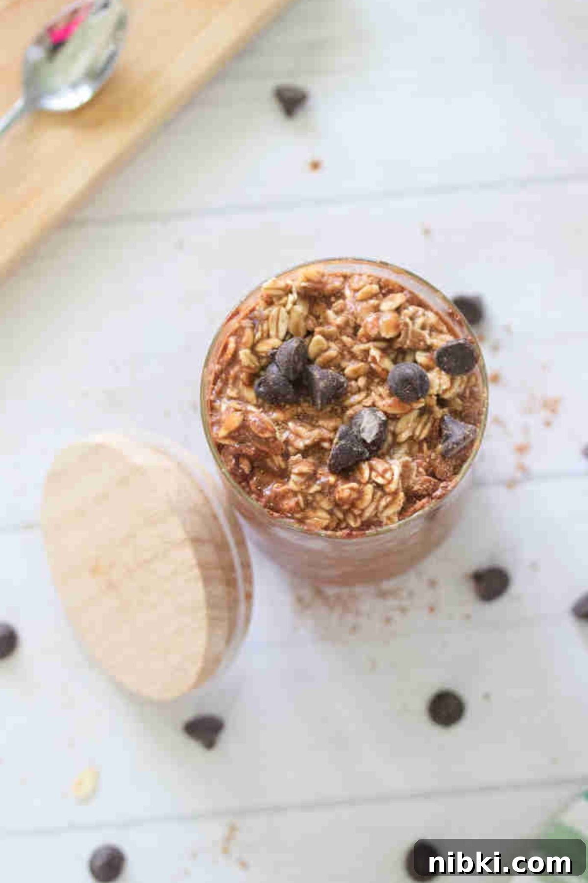 Dairy-Free High-Protein Chocolate Overnight Oats 6 Small jar with chocolate protein overnight oats topped with chocolate chips.