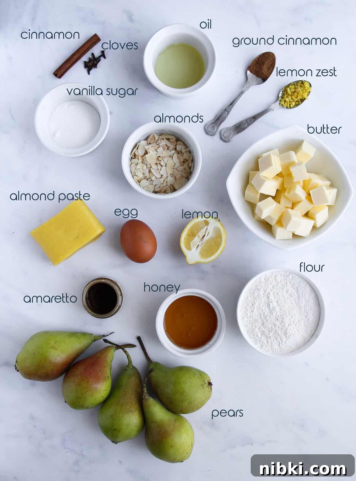 Poached Pear and Almond Tart Recipe 2 Ingredients for almond pear French tart placed on the counter.