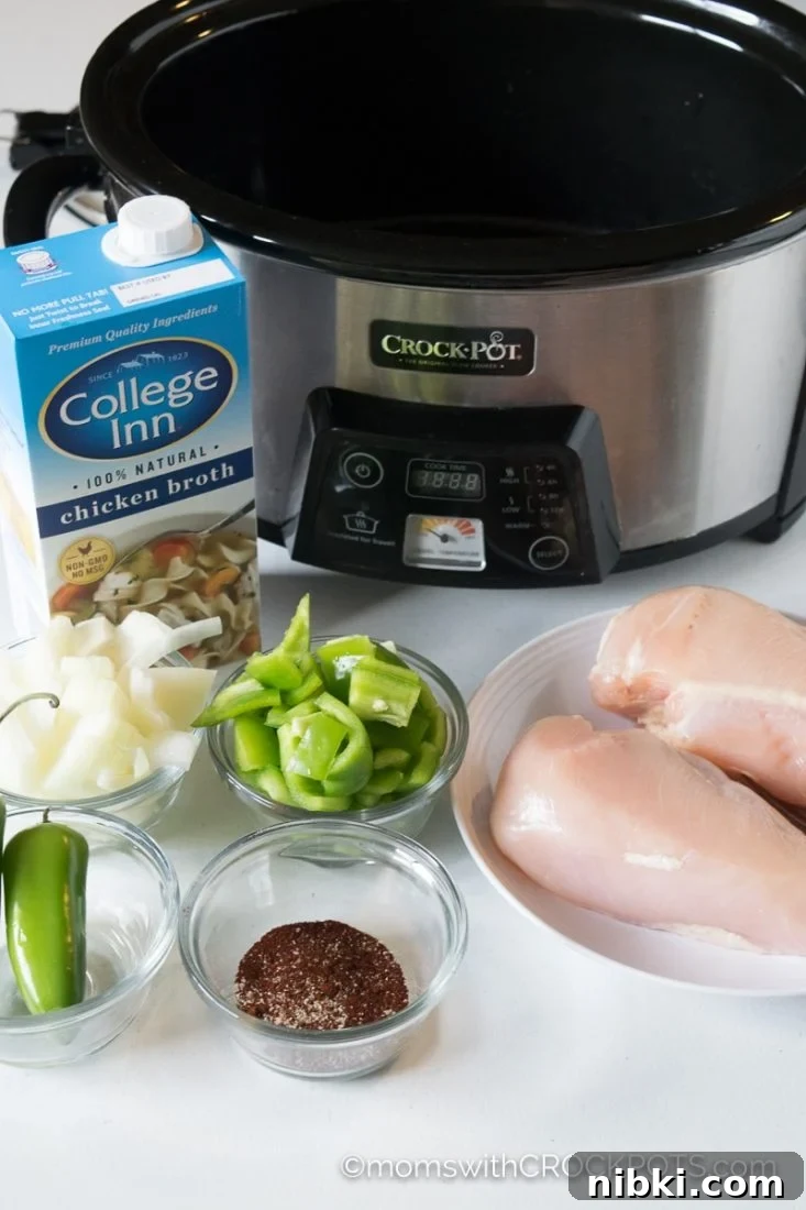 This simple slow cooker soup really packs a punch of flavor! Try this delicious Crockpot Jalapeno Popper Chicken Soup Recipe! Great for game day or any day!