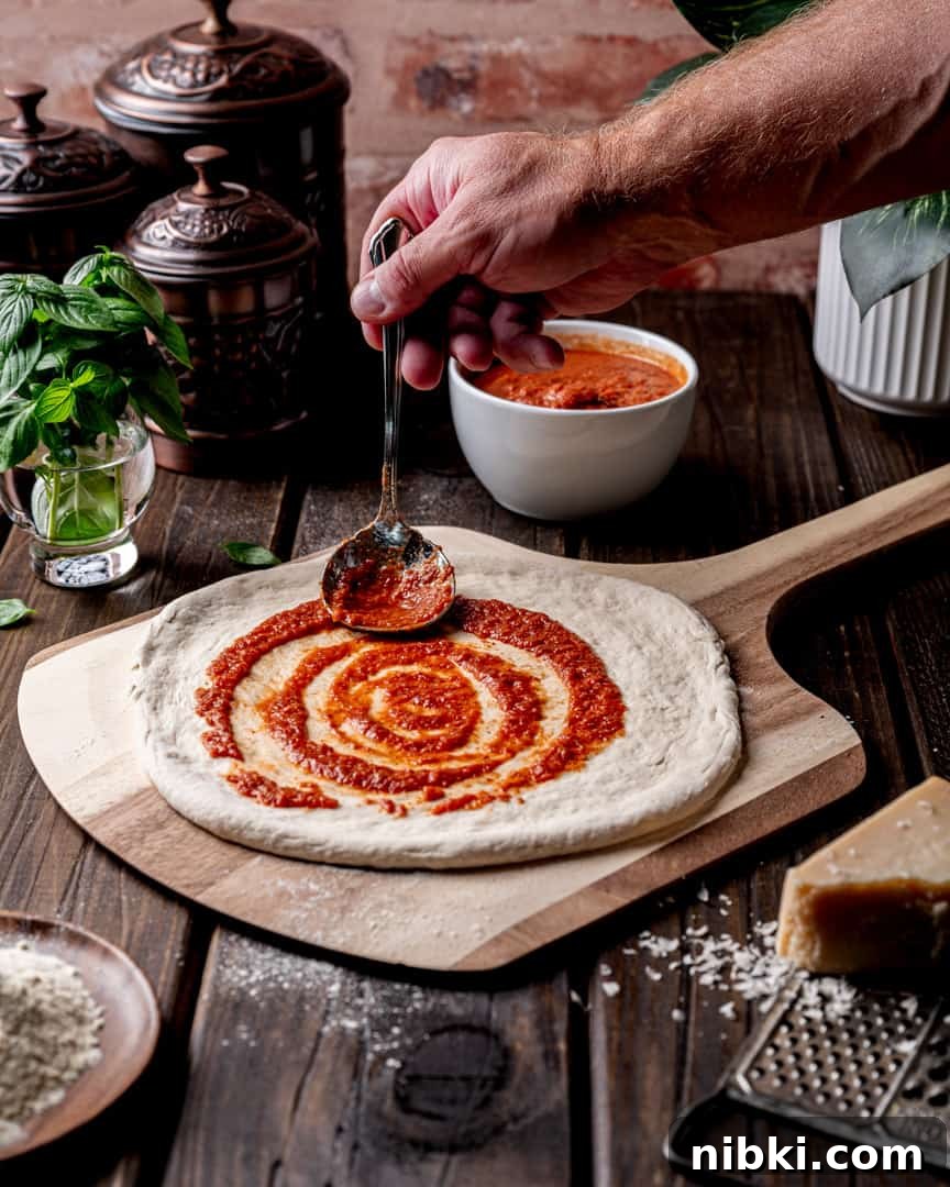 Authentic Neapolitan Pizza Dough Recipe for Perfect Crust 5 Shape and top your pizza on a pizza peel for easy transfer to the oven.
