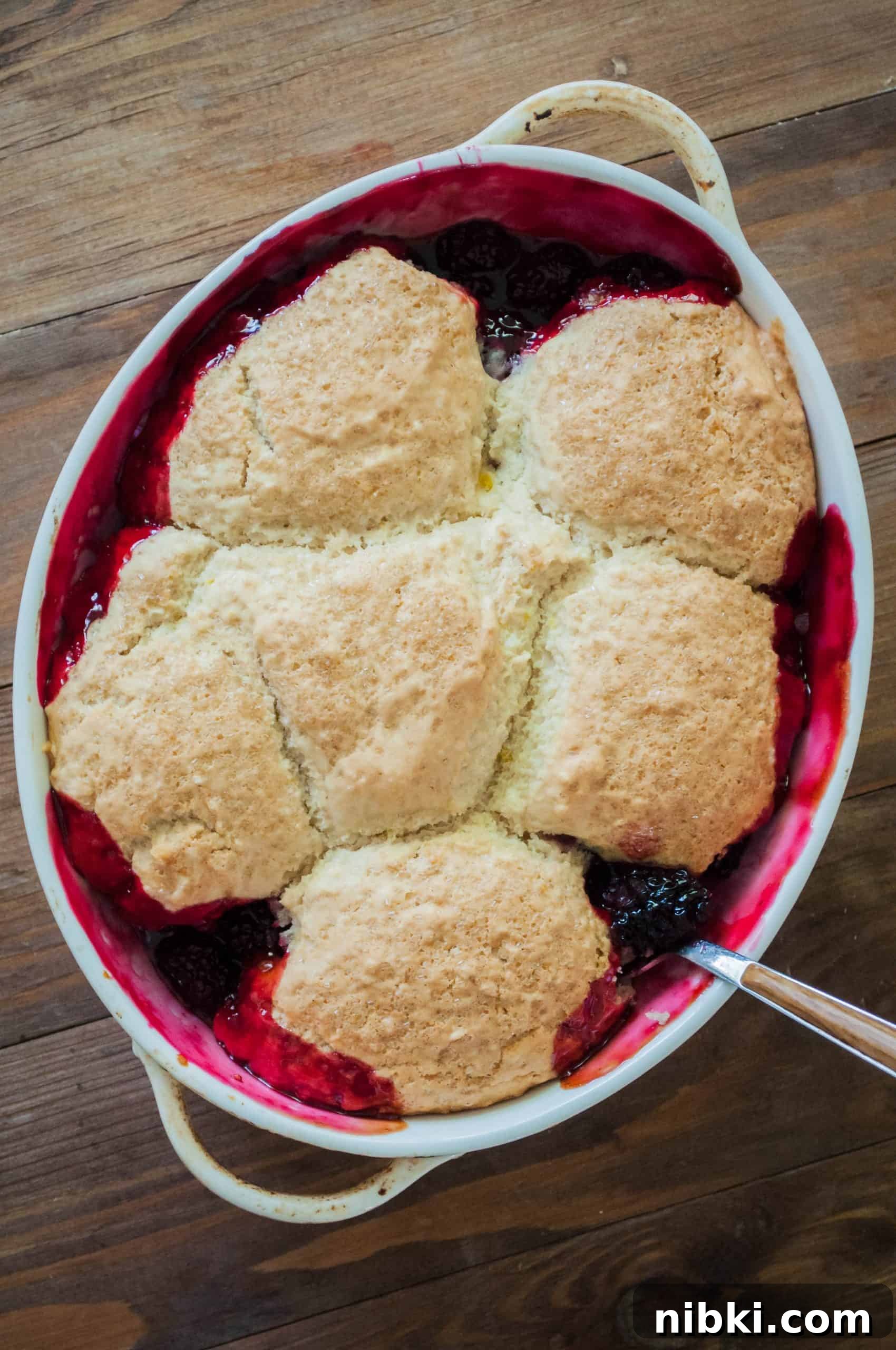 Vegan Blackberry Lemon Cobbler Recipe 5 Scoops of cobbler topping on blackberries