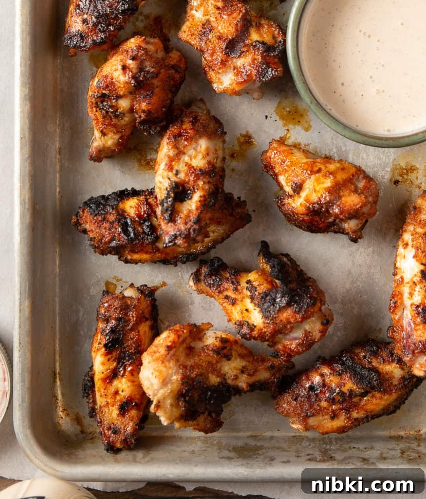 How to Grill Crispy Chicken Wings 4 Chicken wings cooking on the grill