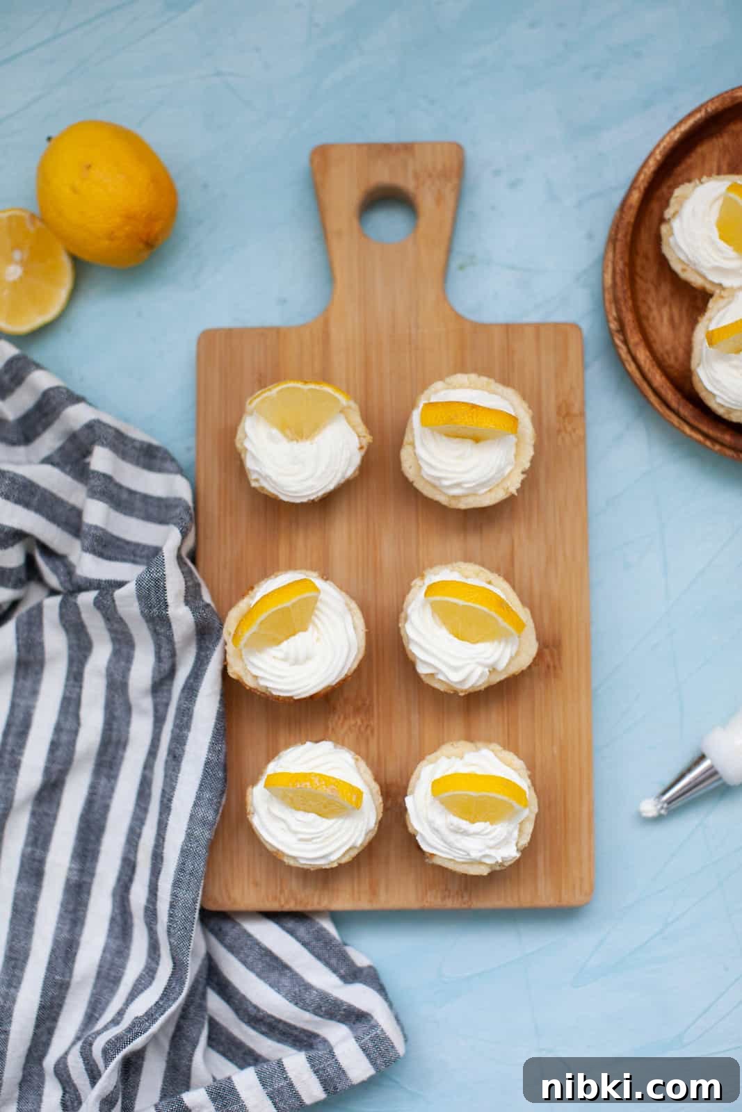 lemon cheesecakes on a wood board
