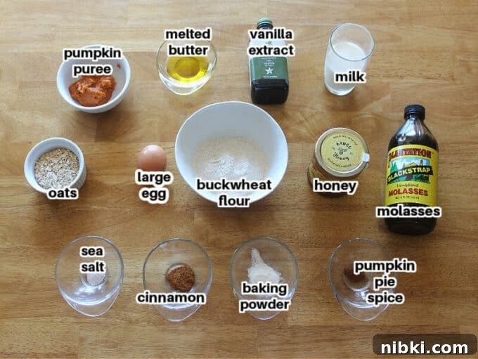 Moist Buckwheat Pumpkin Muffins Recipe 2 Ingredients for muffins on a wood table, including pumpkin and buckwheat flour.