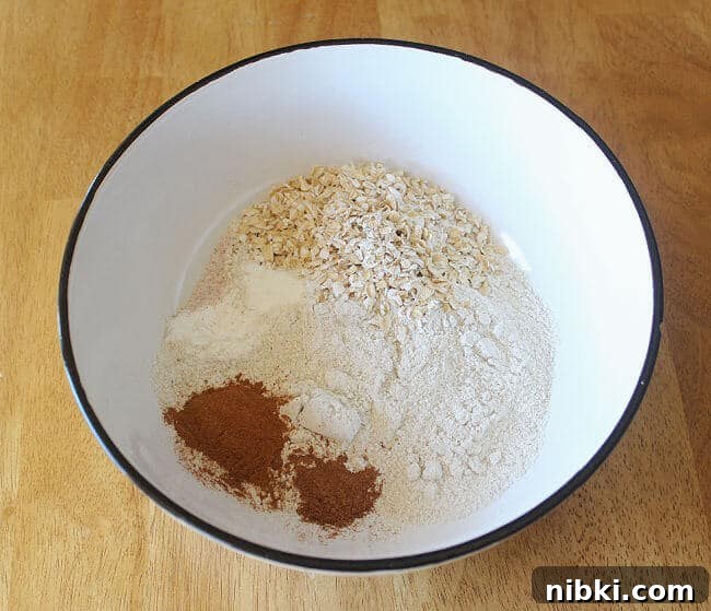 Moist Buckwheat Pumpkin Muffins Recipe 3 Flour, salt, and cinnamon in a large white bowl.
